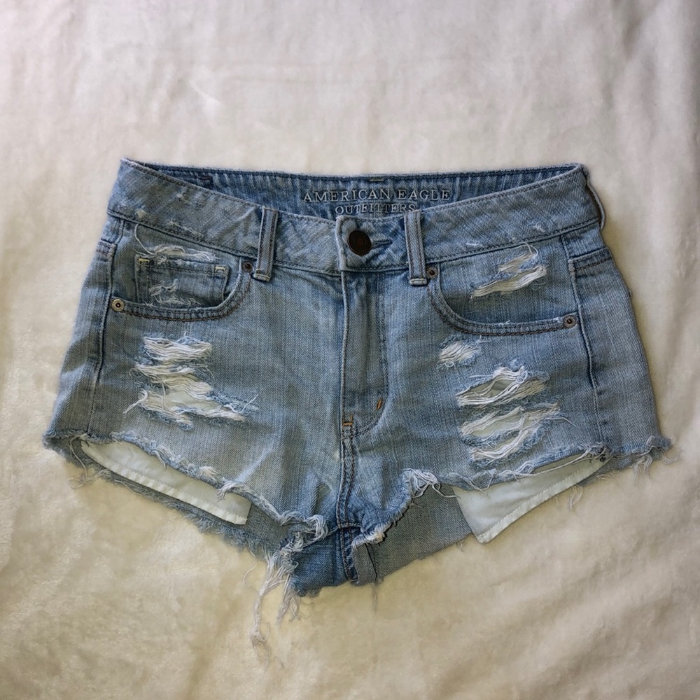 Size 4 light wash AE shorts